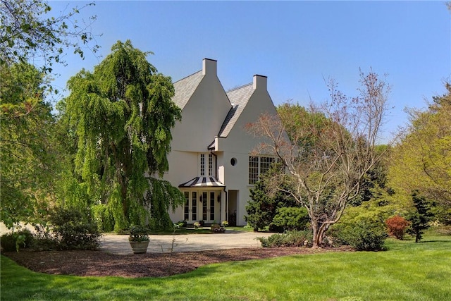 14 Leroy Ave, Newport, RI 02840 - back of house featuring french doors, a lawn, and stucco siding