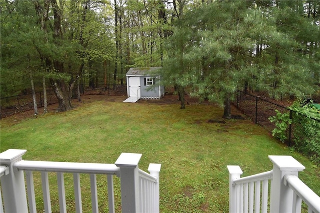 view of yard featuring a shed and an outdoor structure
