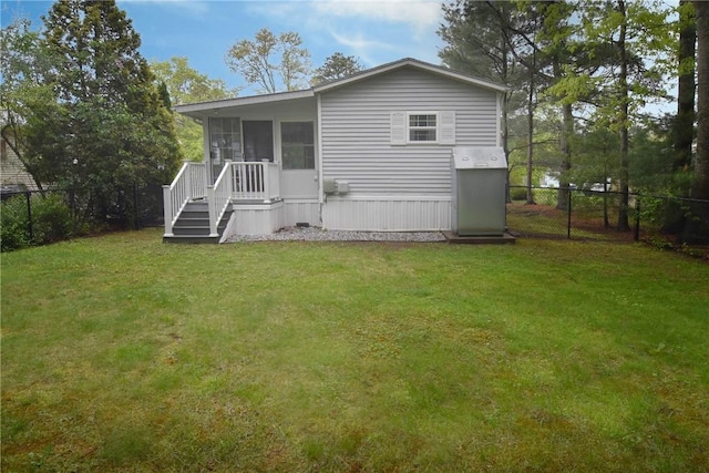 back of house featuring a sunroom