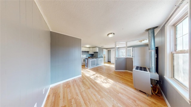 226 Marshall Ave, Cumberland, RI 02864 - unfurnished living room with light wood-style flooring, a textured ceiling, and baseboards