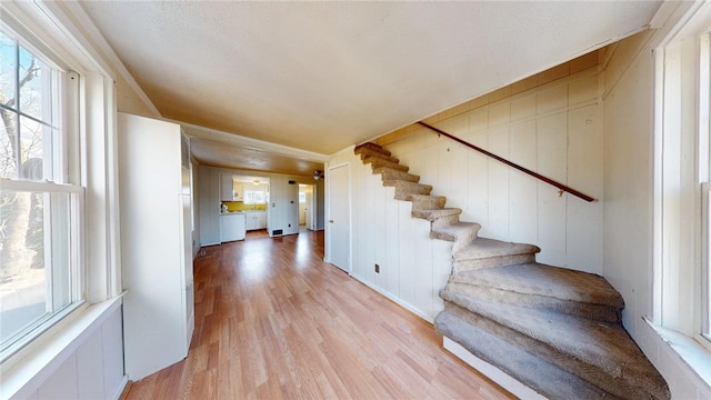 226 Marshall Ave, Cumberland, RI 02864 - staircase featuring wood finished floors and a decorative wall