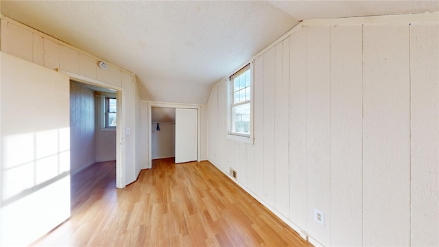 226 Marshall Ave, Cumberland, RI 02864 - unfurnished room featuring vaulted ceiling, light wood-type flooring, and healthy amount of natural light
