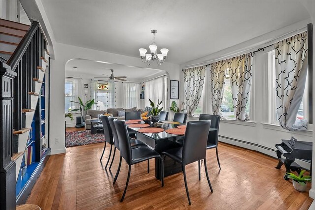 54 Delway Rd, East Providence, RI 02914 - dining space featuring a baseboard radiator, a chandelier, ceiling fan, and wood finished floors