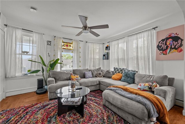 54 Delway Rd, East Providence, RI 02914 - living area featuring a ceiling fan, a baseboard radiator, wood finished floors, and baseboards