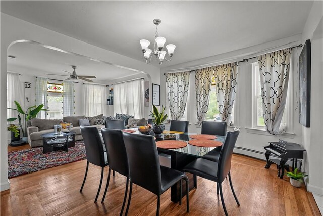 54 Delway Rd, East Providence, RI 02914 - dining room featuring arched walkways, healthy amount of natural light, a chandelier, and a ceiling fan