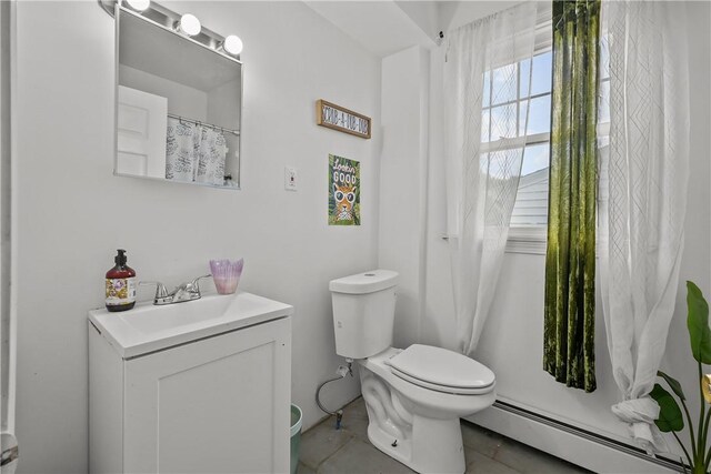 54 Delway Rd, East Providence, RI 02914 - full bath with baseboard heating, toilet, vanity, and tile patterned flooring