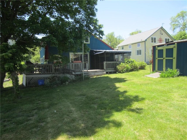 0 Beach Rd, Portsmouth, RI 02871 - view of green lawn featuring a shed, an outbuilding, a sunroom, and a deck