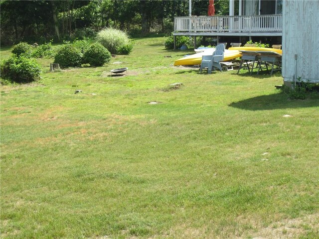 0 Beach Rd, Portsmouth, RI 02871 - view of green lawn with a fire pit and a deck