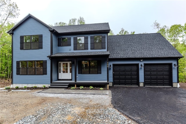 300 Tower Hill Rd, Cumberland, RI 02864 - view of front of property featuring a garage, covered porch, asphalt driveway, roof with shingles, and a balcony