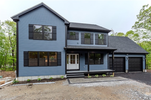 300 Tower Hill Rd, Cumberland, RI 02864 - modern farmhouse style home with a porch, a balcony, a garage, asphalt driveway, and a shingled roof
