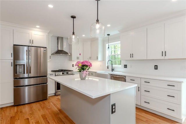 300 Tower Hill Rd, Cumberland, RI 02864 - kitchen featuring appliances with stainless steel finishes, wall chimney exhaust hood, white cabinets, light countertops, and backsplash
