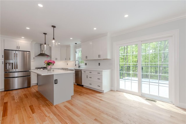 300 Tower Hill Rd, Cumberland, RI 02864 - kitchen with stainless steel appliances, wall chimney exhaust hood, a center island, white cabinetry, and recessed lighting