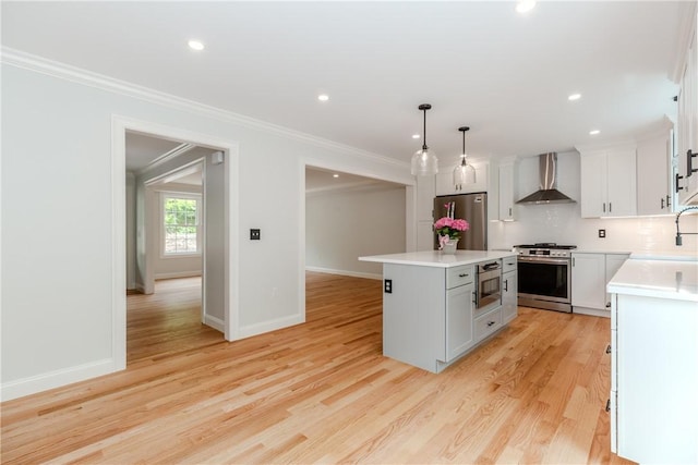 300 Tower Hill Rd, Cumberland, RI 02864 - kitchen with stainless steel appliances, wall chimney exhaust hood, decorative backsplash, a kitchen island, and crown molding