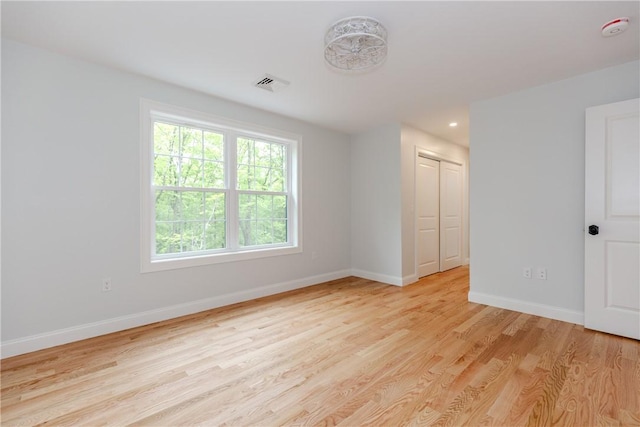 300 Tower Hill Rd, Cumberland, RI 02864 - spare room featuring a smoke detector, light wood-style flooring, and baseboards