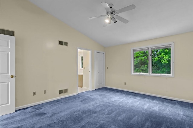unfurnished bedroom featuring carpet, baseboards, lofted ceiling, a ceiling fan, and ensuite bathroom
