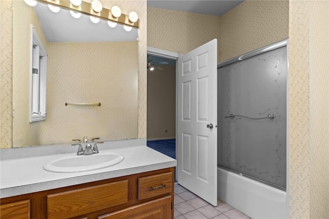bathroom featuring wallpapered walls, vanity, tile patterned flooring, and bathing tub / shower combination