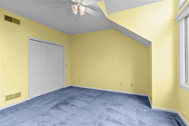 unfurnished bedroom with carpet, baseboards, ceiling fan, and a closet