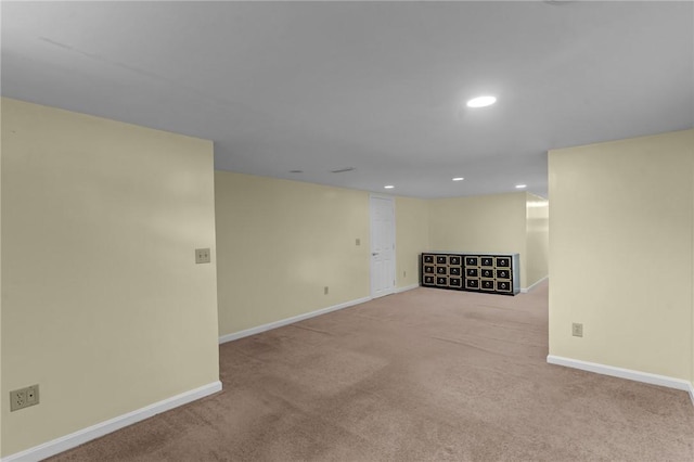 basement with carpet, baseboards, and recessed lighting