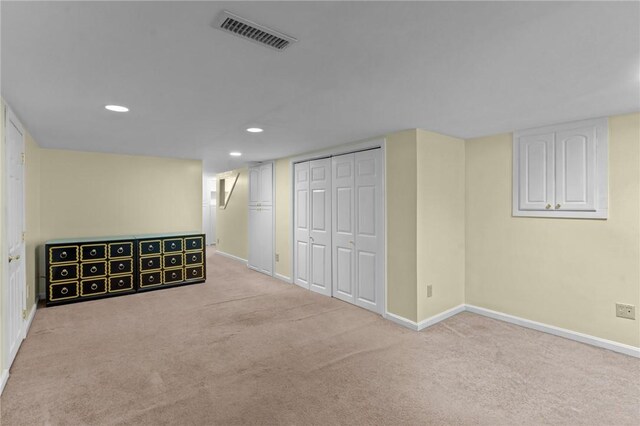 finished basement featuring carpet flooring, baseboards, and recessed lighting