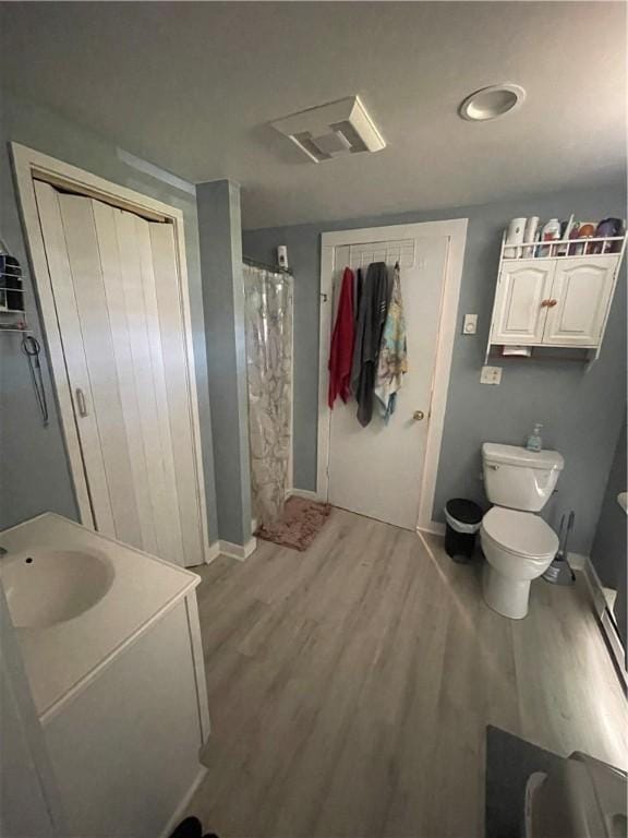 8 Aldrich St, Hopkinton, RI 02898 - full bathroom with wood finished floors, toilet, vanity, and curtained shower