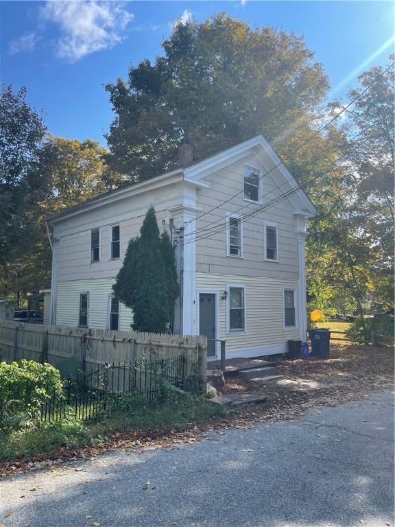 8 Aldrich St, Hopkinton, RI 02898 - view of front of property featuring fence and a chimney