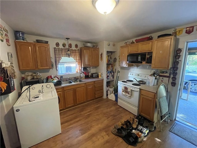 8 Aldrich St, Hopkinton, RI 02898 - kitchen with washer / dryer, black microwave, white range with electric stovetop, and plenty of natural light