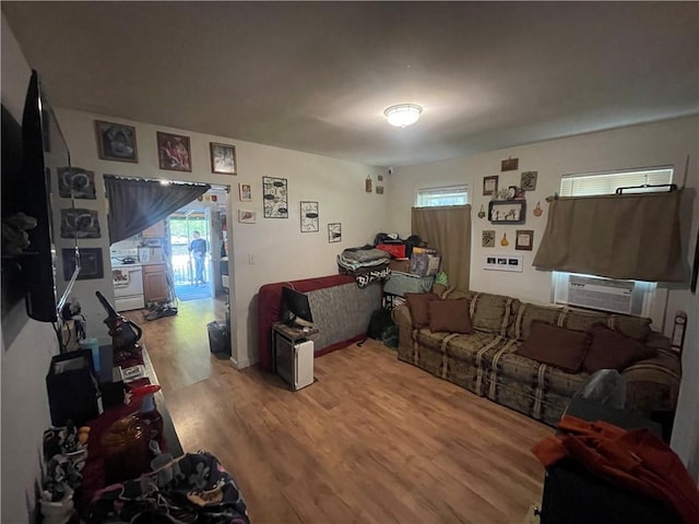 8 Aldrich St, Hopkinton, RI 02898 - living room featuring wood finished floors, cooling unit, and plenty of natural light