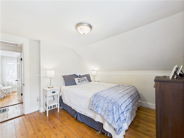 39 Union St, East Greenwich, RI 02818 - bedroom with wood-type flooring, baseboards, and lofted ceiling