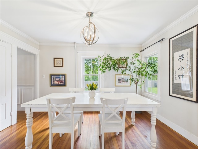 39 Union St, East Greenwich, RI 02818 - dining space with a chandelier, wood finished floors, and crown molding