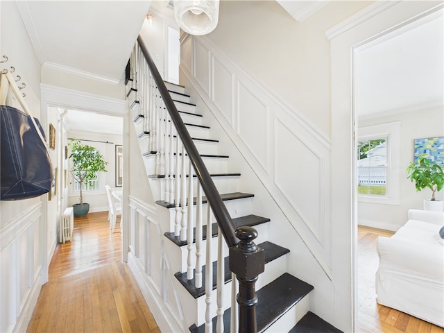 39 Union St, East Greenwich, RI 02818 - stairs with hardwood / wood-style floors, radiator, and ornamental molding