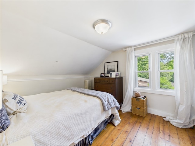 39 Union St, East Greenwich, RI 02818 - bedroom featuring radiator, hardwood / wood-style flooring, baseboards, and lofted ceiling