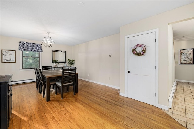 31 Corey Trl, Richmond, RI 02898 - dining room featuring a baseboard heating unit, baseboard heating, a chandelier, light wood-type flooring, and baseboards