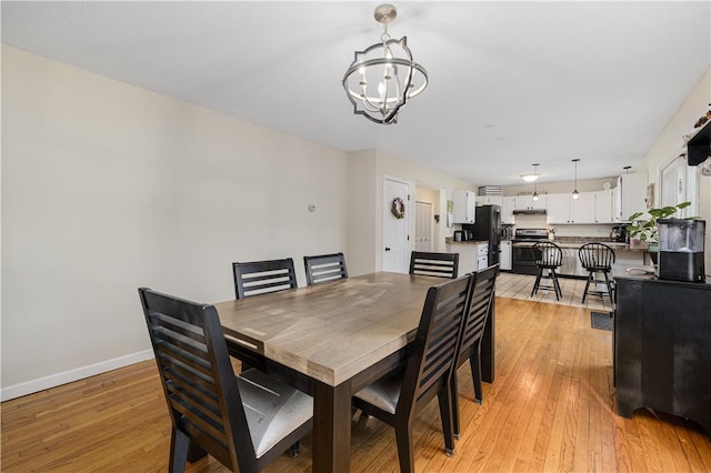 31 Corey Trl, Richmond, RI 02898 - dining area featuring a chandelier, light wood finished floors, and baseboards