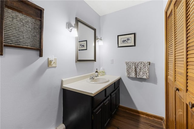 31 Corey Trl, Richmond, RI 02898 - bathroom featuring wood finished floors, baseboards, vanity, and a closet
