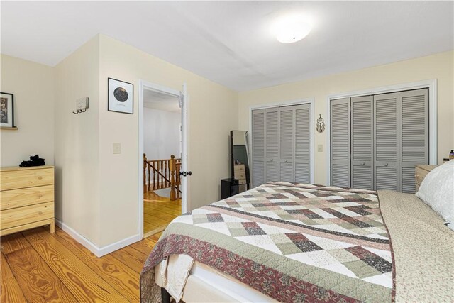 31 Corey Trl, Richmond, RI 02898 - bedroom featuring light wood-style floors, multiple closets, and baseboards