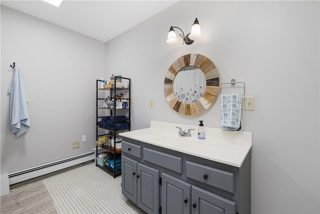 31 Corey Trl, Richmond, RI 02898 - bathroom featuring baseboard heating, vanity, and tile patterned floors