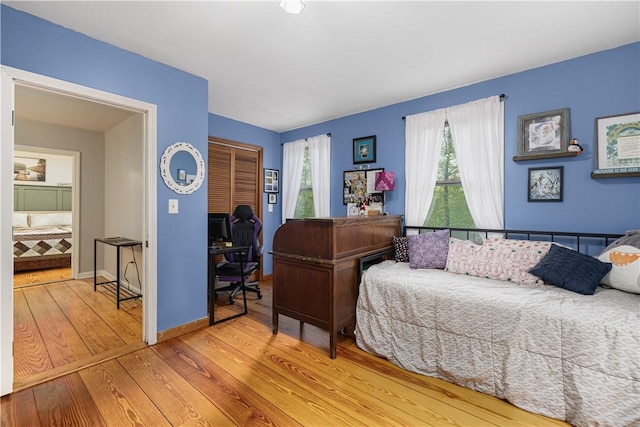 31 Corey Trl, Richmond, RI 02898 - bedroom with an office area, hardwood / wood-style floors, a closet, and baseboards