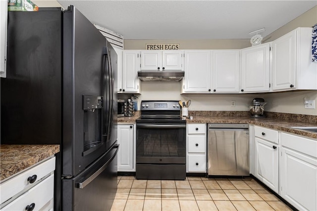 31 Corey Trl, Richmond, RI 02898 - kitchen with stainless steel appliances, under cabinet range hood, light tile patterned floors, dark countertops, and white cabinetry