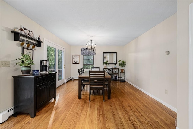 31 Corey Trl, Richmond, RI 02898 - dining area with a chandelier, light wood-type flooring, a baseboard heating unit, and baseboards
