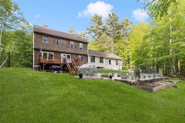 31 Corey Trl, Richmond, RI 02898 - back of house with a greenhouse, a garden, a chimney, a wooden deck, and an outdoor structure