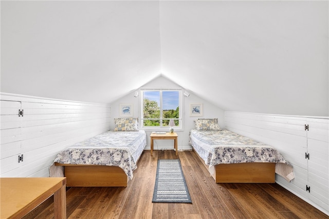 125 Sakonnet Point Rd, Little Compton, RI 02837 - bedroom with wood finished floors, vaulted ceiling, and wooden walls