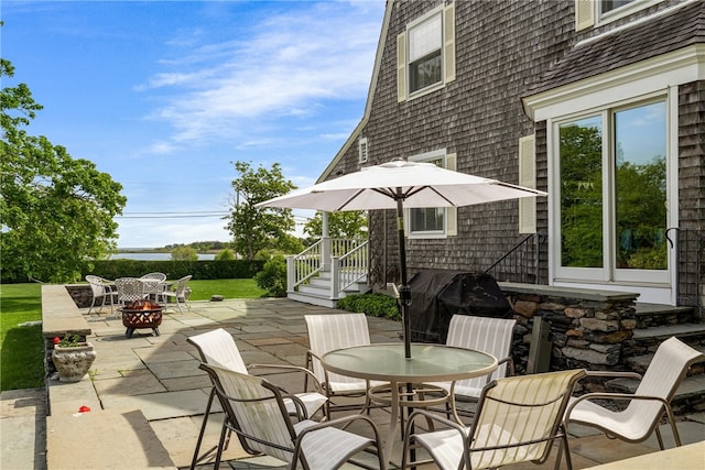 125 Sakonnet Point Rd, Little Compton, RI 02837 - view of patio with an outdoor fire pit and outdoor dining space