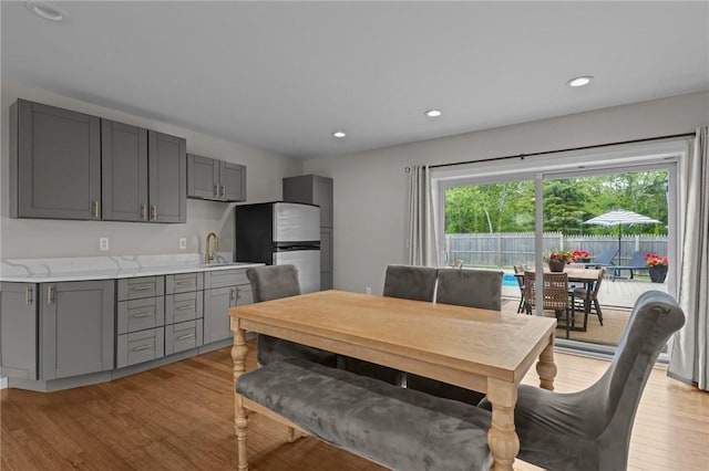 96 Roger Williams Dr, North Kingstown, RI 02852 - dining area with light wood-style flooring and recessed lighting