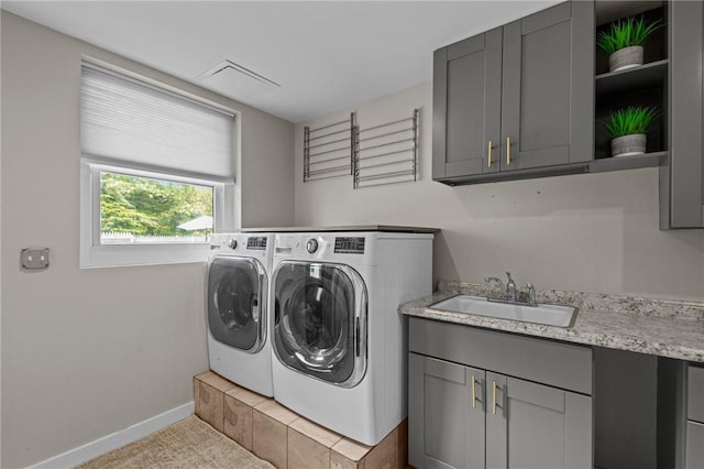 96 Roger Williams Dr, North Kingstown, RI 02852 - laundry room with washing machine and dryer, cabinet space, baseboards, and carpet floors