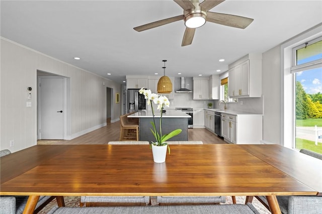 96 Roger Williams Dr, North Kingstown, RI 02852 - dining area featuring crown molding, baseboards, ceiling fan, light wood finished floors, and recessed lighting