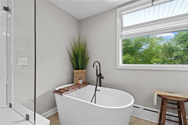 96 Roger Williams Dr, North Kingstown, RI 02852 - full bath featuring a stall shower, a soaking tub, baseboards, and baseboard heating