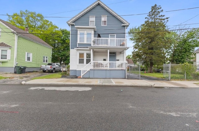 97 Detroit Ave, Providence, RI 02907 - traditional-style house featuring a balcony and covered porch
