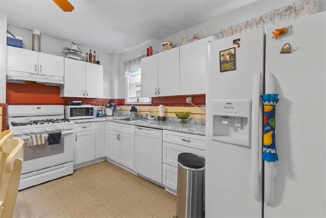 97 Detroit Ave, Providence, RI 02907 - kitchen featuring white appliances, under cabinet range hood, light countertops, and white cabinets