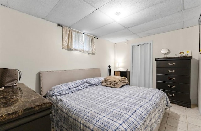 97 Detroit Ave, Providence, RI 02907 - bedroom featuring a drop ceiling and light tile patterned floors