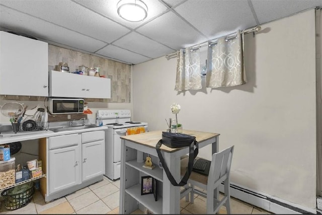 97 Detroit Ave, Providence, RI 02907 - kitchen with white electric range oven, black microwave, a paneled ceiling, a baseboard heating unit, and light tile patterned floors